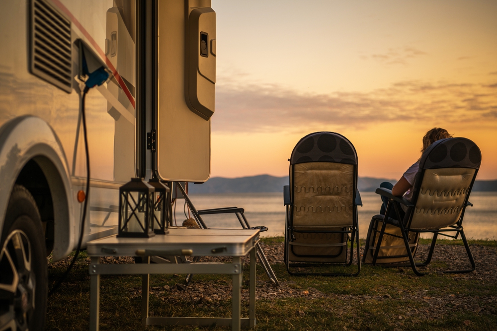 A woman living in an rv full time in a park.